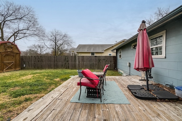 wooden terrace with a yard