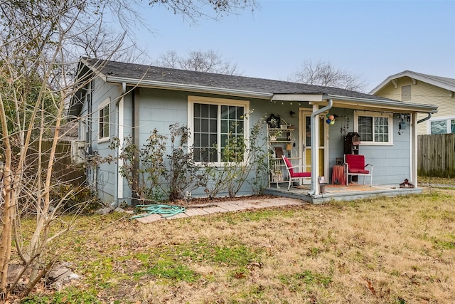 ranch-style home featuring a front yard