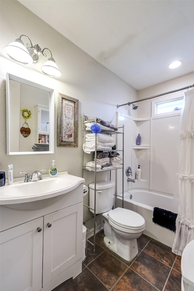 full bathroom with shower / bath combo, vanity, and toilet