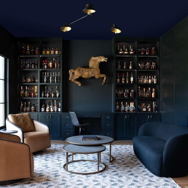 interior space featuring light hardwood / wood-style flooring and blue cabinetry