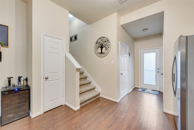 entrance foyer with hardwood / wood-style floors