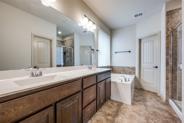 bathroom featuring vanity and separate shower and tub