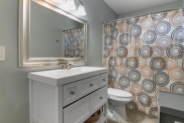 bathroom featuring tile patterned floors, vanity, and toilet