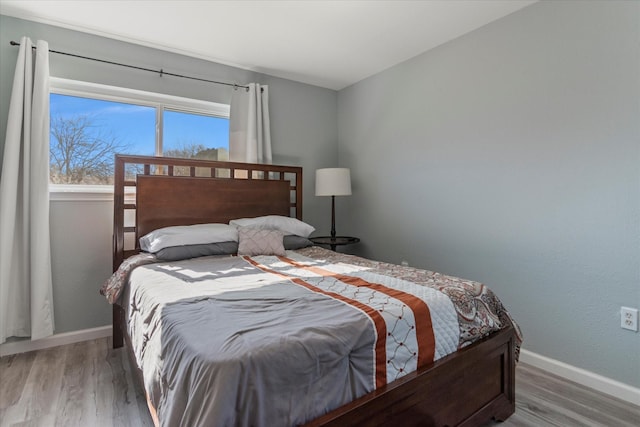 bedroom featuring hardwood / wood-style flooring