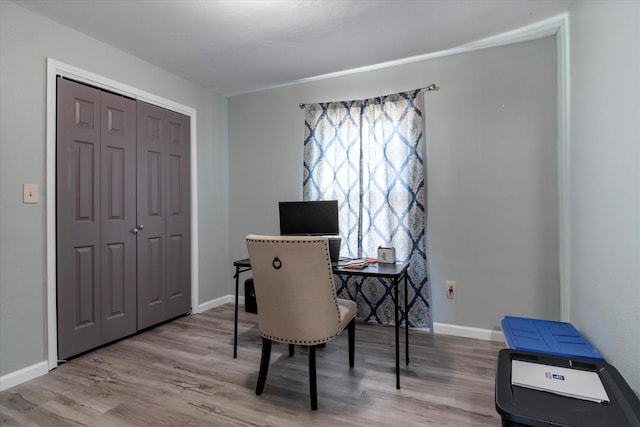 home office featuring a wealth of natural light and light hardwood / wood-style floors