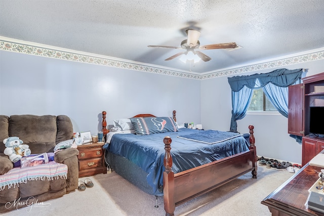 bedroom featuring ceiling fan, a textured ceiling, and carpet flooring