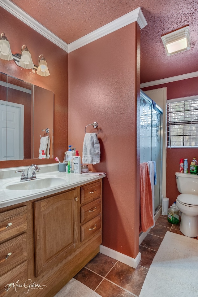 bathroom featuring ornamental molding, a textured ceiling, and a shower with shower door