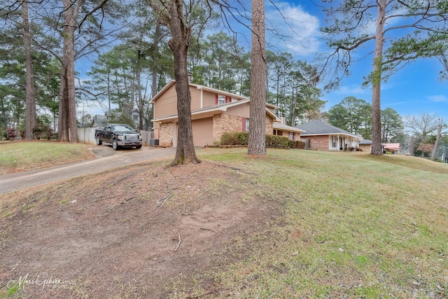 view of side of property with a yard