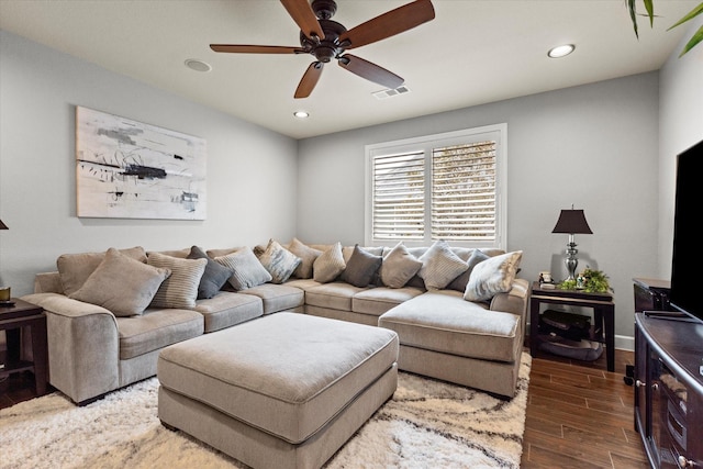 living room featuring hardwood / wood-style flooring and ceiling fan