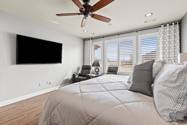 bedroom featuring ceiling fan and hardwood / wood-style floors