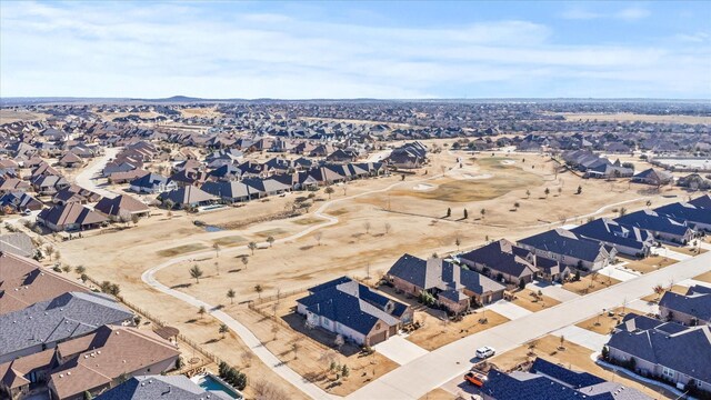 view of property's community featuring a yard