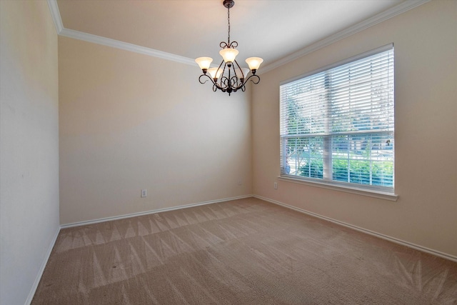 spare room with a notable chandelier, ornamental molding, and carpet