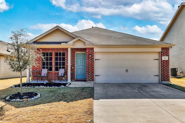 view of front of house featuring a garage, central AC, and a front yard