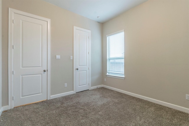 unfurnished bedroom with carpet