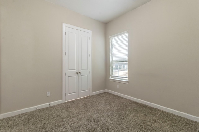 spare room featuring carpet flooring