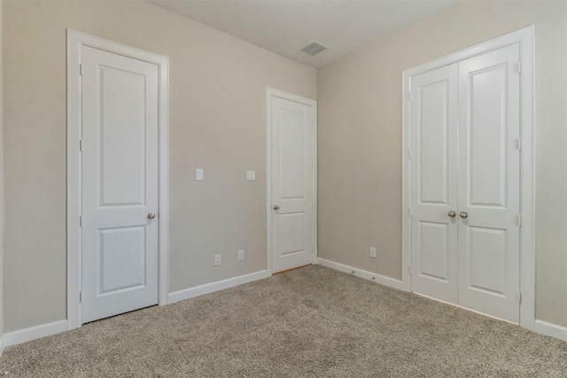 unfurnished bedroom featuring carpet