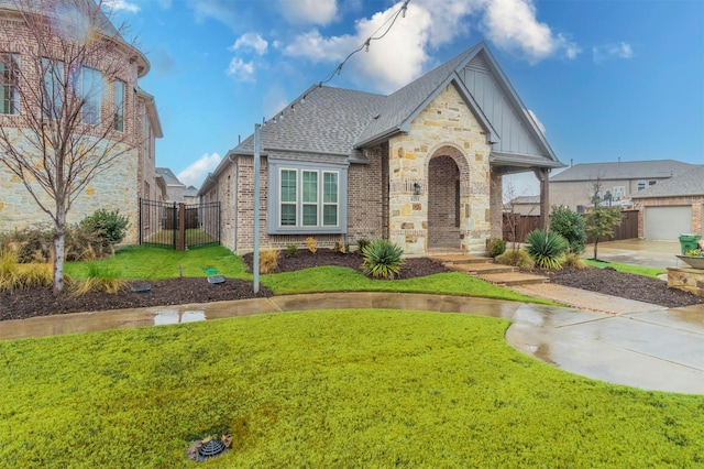 view of front of property featuring a garage and a front yard