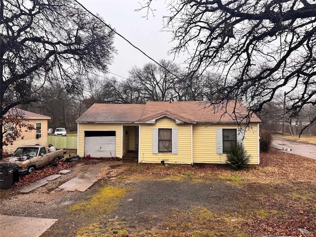 ranch-style house featuring a garage