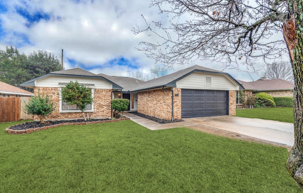 single story home with a garage and a front yard