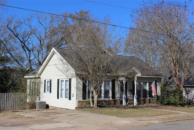 view of front of house with cooling unit and a porch