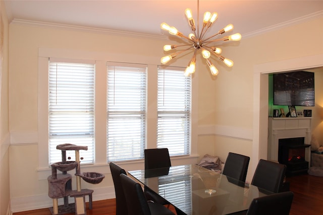 dining room featuring crown molding, dark hardwood / wood-style flooring, and a chandelier