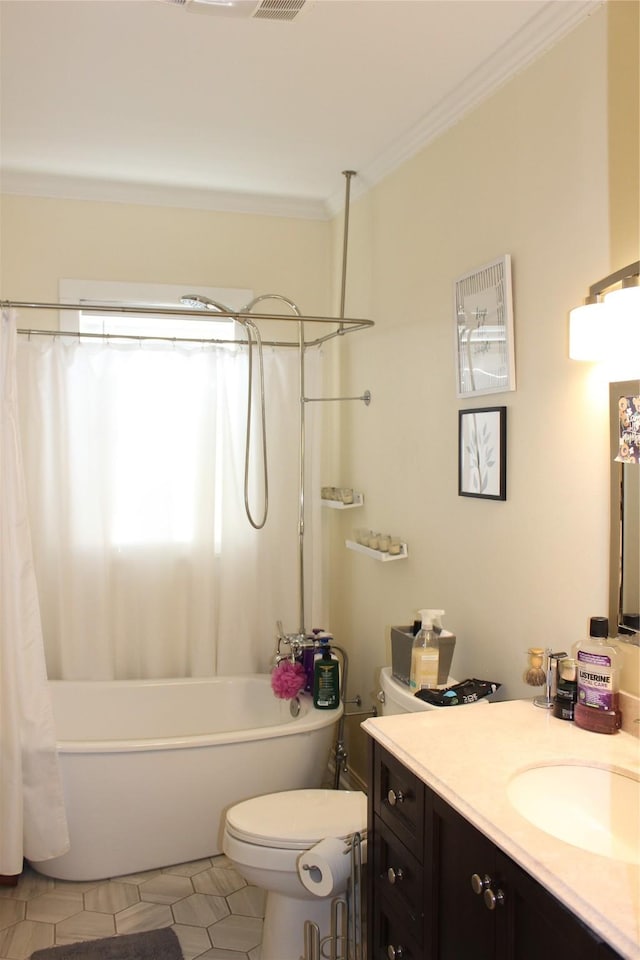 full bathroom featuring shower / bath combination with curtain, ornamental molding, vanity, toilet, and tile patterned floors