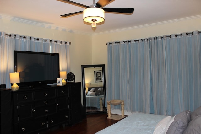 bedroom with ceiling fan, ornamental molding, and dark hardwood / wood-style flooring