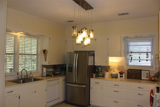 kitchen with sink, hanging light fixtures, stainless steel refrigerator with ice dispenser, white dishwasher, and white cabinets