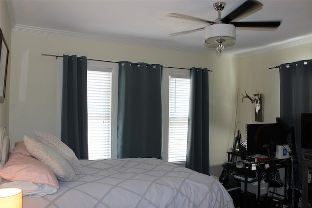 bedroom with multiple windows, crown molding, and ceiling fan