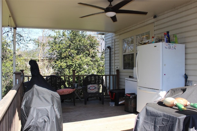 view of patio featuring area for grilling, a deck, and ceiling fan