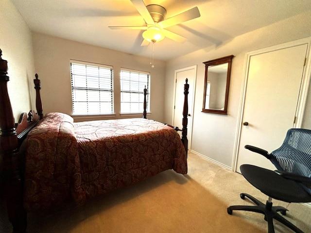 carpeted bedroom featuring ceiling fan