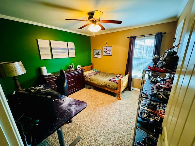 bedroom featuring ceiling fan, ornamental molding, and carpet