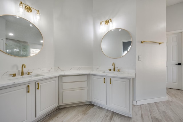 bathroom featuring hardwood / wood-style flooring and vanity