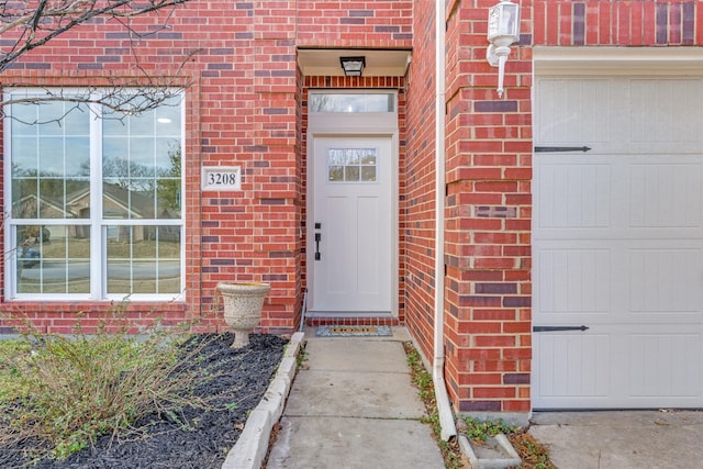 view of exterior entry featuring a garage