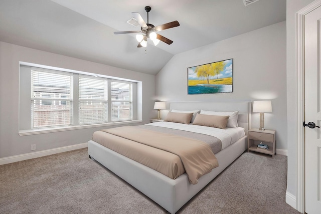 carpeted bedroom with ceiling fan, lofted ceiling, and baseboards
