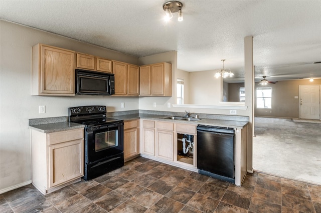 kitchen featuring decorative light fixtures, sink, light brown cabinets, and black appliances