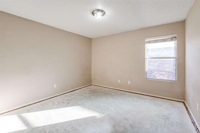 spare room featuring a textured ceiling