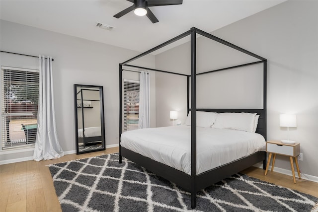 bedroom featuring hardwood / wood-style floors and ceiling fan