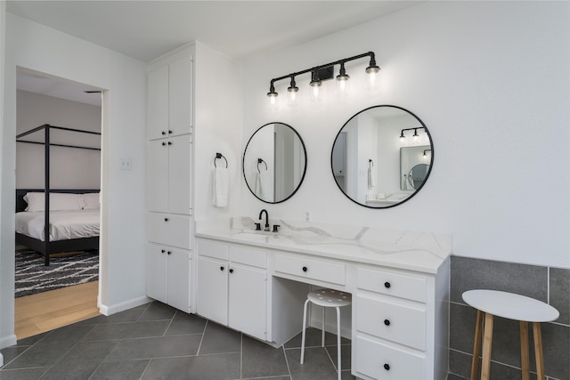 bathroom with vanity and tile patterned flooring