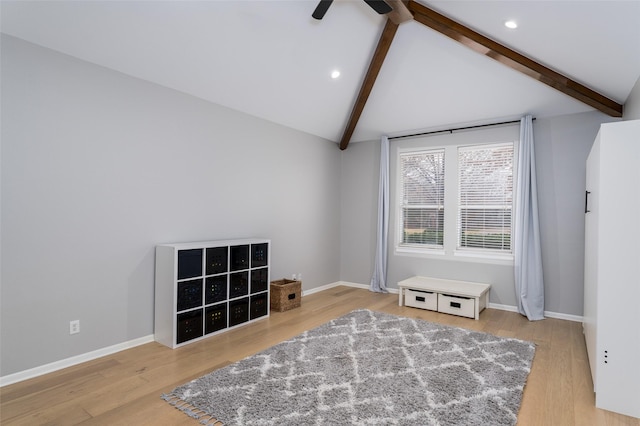 interior space featuring lofted ceiling with beams, ceiling fan, and light hardwood / wood-style floors