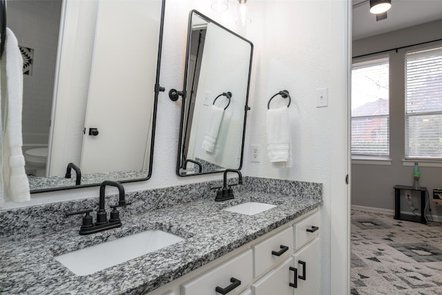 bathroom with vanity and toilet