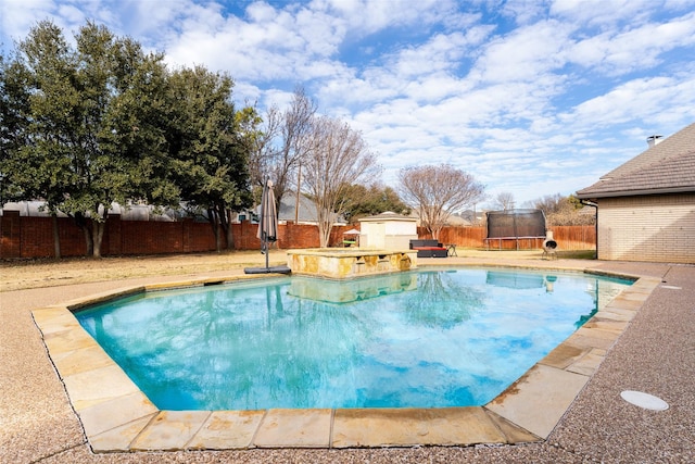 view of pool featuring a trampoline