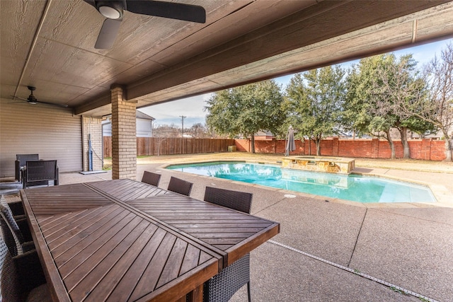 view of pool with a patio area and ceiling fan