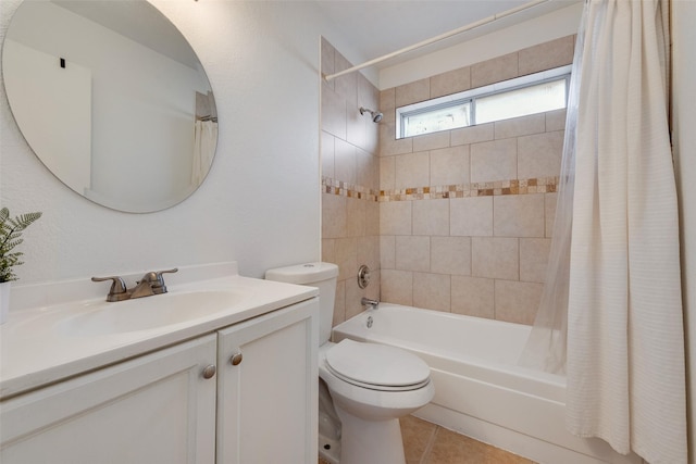 full bathroom featuring toilet, tile patterned floors, vanity, and shower / bathtub combination with curtain