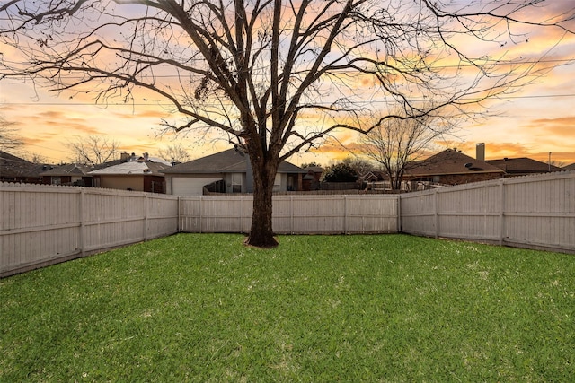 view of yard at dusk