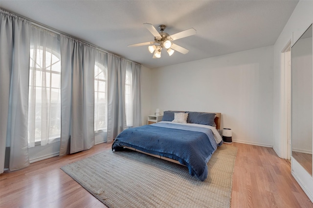 bedroom featuring ceiling fan and light wood-type flooring