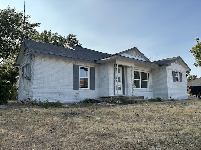 ranch-style house with brick siding