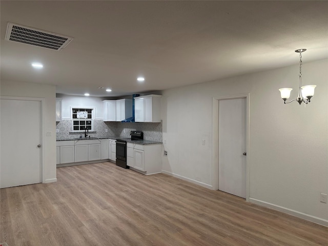 kitchen with white cabinetry, decorative light fixtures, light wood-type flooring, electric range, and decorative backsplash