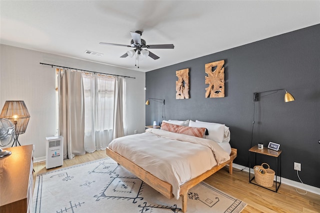 bedroom featuring ceiling fan and light wood-type flooring