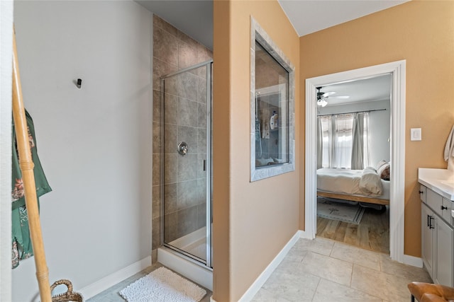 bathroom featuring vanity, tile patterned flooring, and a shower with door